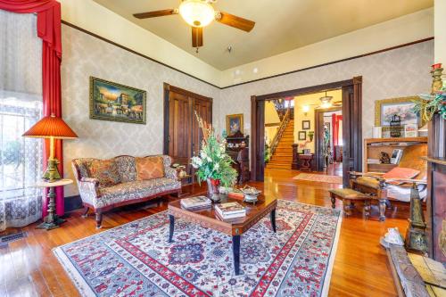 a living room with a couch and a table at Grand Gables Home 1 Block to St Johns River! in Palatka
