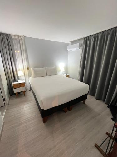 Postel nebo postele na pokoji v ubytování Tempo Rent Apart Hotel