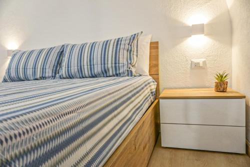 Letto o letti in una camera di Carmelitani Loft Catania Center
