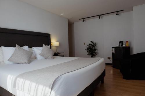 Postel nebo postele na pokoji v ubytování Tempo Rent Apart Hotel