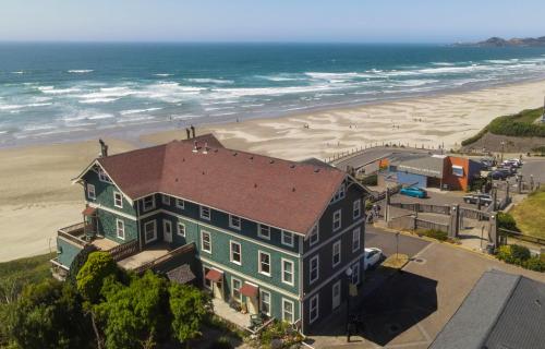 an aerial view of a house and the beach at Hotel Sylvia in Newport