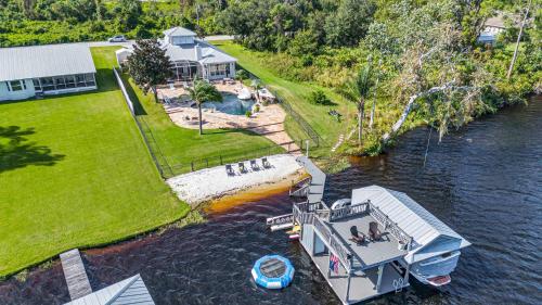 an aerial view of a boat in a river at 5Br Sleeps 16 Private Pool-Dog Friendly-Fire Pit in Lake Placid