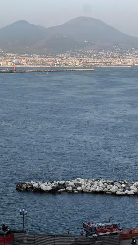 a large body of water with a boat in it at La Corte di Partenope Luxury Suite in Naples