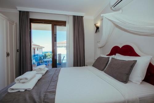 Postel nebo postele na pokoji v ubytování Cunda Say Resort