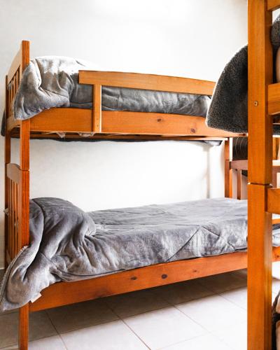 a couple of bunk beds in a room at Firmat Apart Premium Estadías confortables para empresas y familias 2 in Firmat