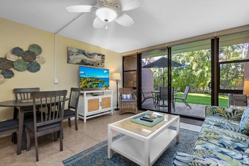 a living room with a couch and a table at MV2123 Serene Hawaiian Beachside Bliss in Kihei