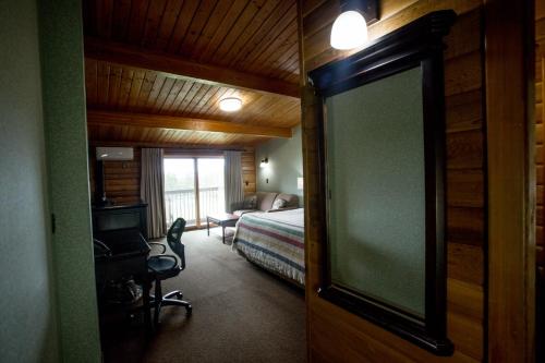 Postel nebo postele na pokoji v ubytování Oakwood Resort