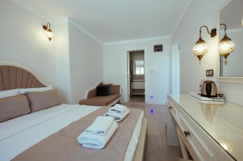 Postel nebo postele na pokoji v ubytování Cunda Say Resort