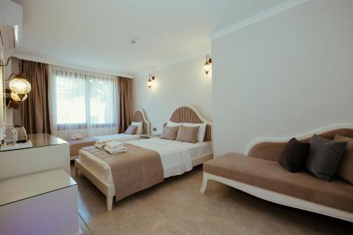 Postel nebo postele na pokoji v ubytování Cunda Say Resort