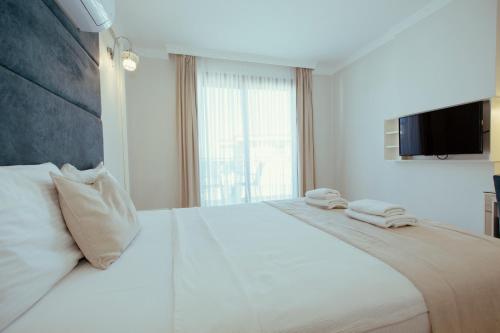 Postel nebo postele na pokoji v ubytování Cunda Say Resort