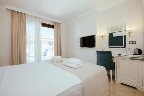 Postel nebo postele na pokoji v ubytování Cunda Say Resort