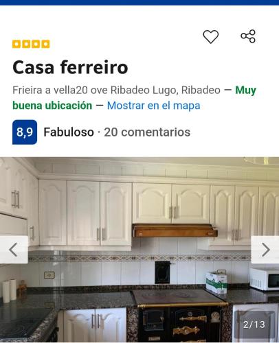 a screenshot of a kitchen with white cabinets at Casa ferreiro in Ribadeo