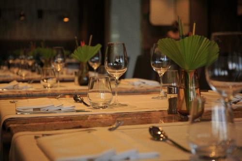 a table with glasses of wine on it at Radisson Blu Hotel, Abidjan Airport in Abidjan