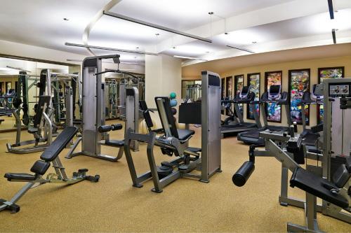 a gym with a lot of treadmills and machines at St. Regis Aspen Resort in Aspen