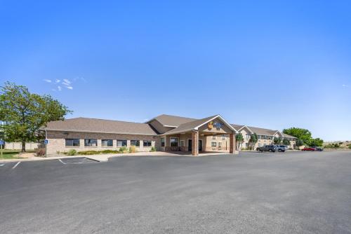 a large office building with a parking lot at Comfort Inn Grand Junction I-70 in Grand Junction