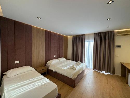 Postel nebo postele na pokoji v ubytování Hotel Sanremo Vlore