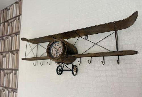 a small airplane hanging on a wall at Comfy NEC, Birmingham Airport Stay, Free Parking in Birmingham