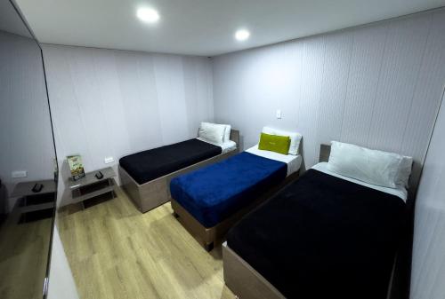 Postel nebo postele na pokoji v ubytování Hotel Feria Imperial Embajada