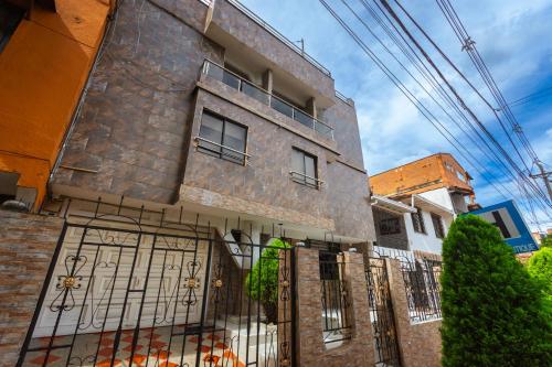 a building with a gate in front of it at Hotel Colores Boutique in Medellín