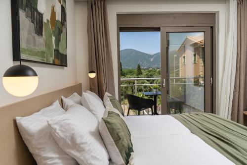 a bedroom with a bed and a balcony with a view at Maera Apartments in Sami