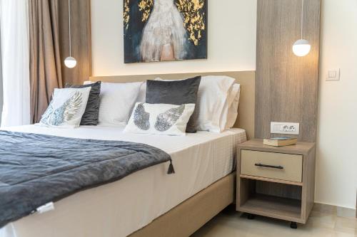 a bedroom with a bed and a night stand at Maera Apartments in Sami