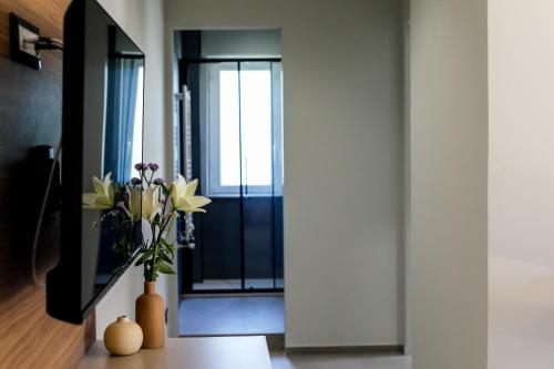 TV a/nebo společenská místnost v ubytování VentunoDodici Oliveri Apartments