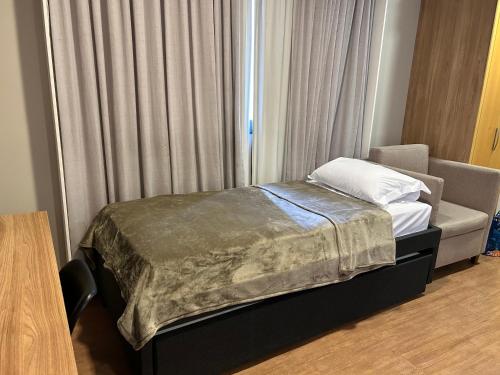 Postel nebo postele na pokoji v ubytování TOP quarto Stay Inn hotel 3 min Av Paulista