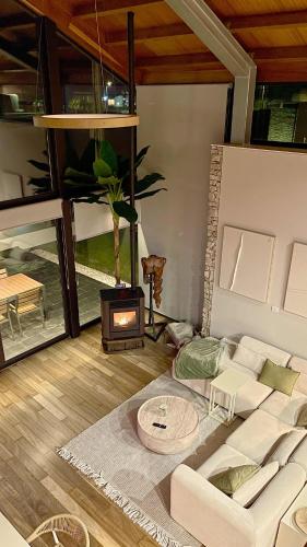 a living room with a couch and a fireplace at The Cliffs - OceanLight 