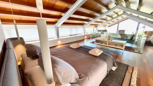 a bedroom with a bed with two towels on it at The Cliffs - OceanLight 
