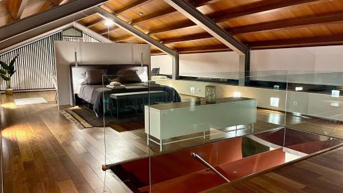 a bedroom with a bed and a glass table at The Cliffs - OceanLight 