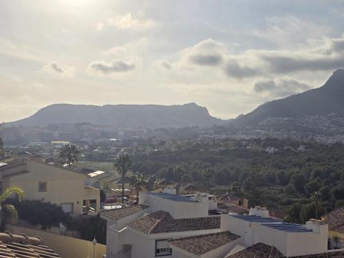 a view of a city with mountains in the background at Casanova 20G Calpe in Calpe