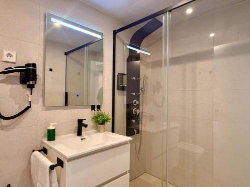a bathroom with a sink and a shower at dozZze - Madrid Río in Madrid