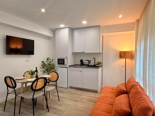 a living room with a couch and a table at dozZze - Madrid Río in Madrid