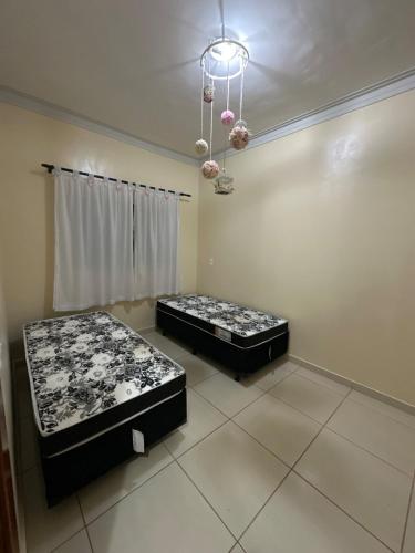 two mattresses in a room with two beds at Casa 3Q accesso ao Daia, Havan, Unievangelica in Anápolis