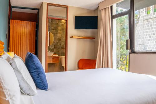 Postel nebo postele na pokoji v ubytování Hotel Agave Baños
