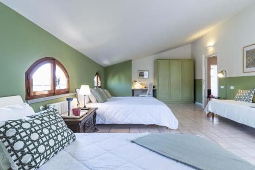 Giường trong phòng chung tại Italian Experience-Villa I Portici