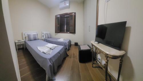 Ένα ή περισσότερα κρεβάτια σε δωμάτιο στο LM Hotel Araçatuba