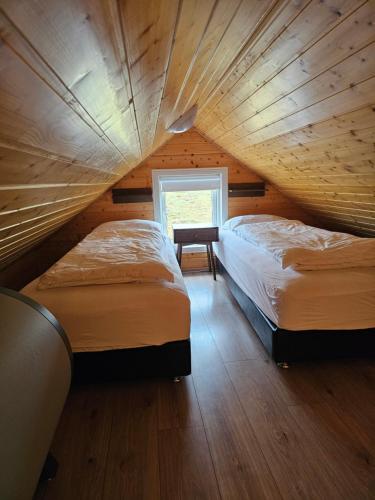 Postel nebo postele na pokoji v ubytování Starmýri 2 Cottages