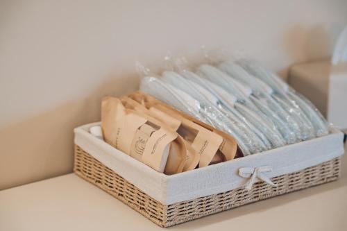 a basket filled with plates and glasses on a table at MONTHLIV Euljiro Hotel Stay in Seoul