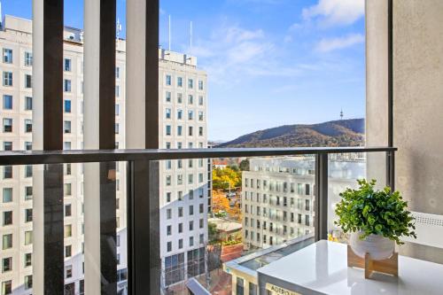 a view from the balcony of a building at Patio Mt view 1BR apt in CBD near ANU and museum with free parking and WiFi in Canberra