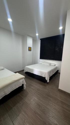 Katil atau katil-katil dalam bilik di Casa finca de 3 pisos con jacuzzi