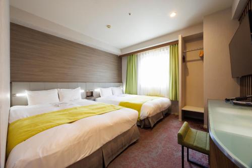 Postel nebo postele na pokoji v ubytování Hotel Sardonyx Ueno