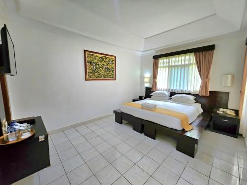 Voodi või voodid majutusasutuse Satriya Cottages toas
