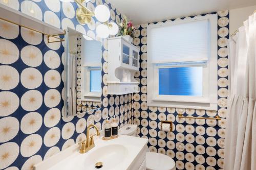 a bathroom with a sink and a mirror at Quiet City Retreat Near Light Rail, Downtown & Stadiums! in Seattle