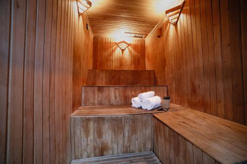 a sauna with two towels on a wooden wall at Ker Belgrano Hotel in Buenos Aires