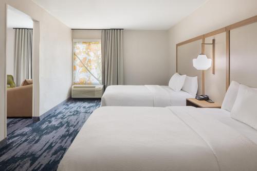 a hotel room with two beds and a window at Fairfield by Marriott Mission Viejo Orange County in Mission Viejo
