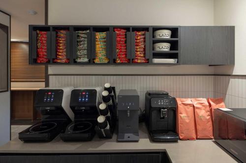 a counter with a bunch of different types at Aank Hotel and Spa Daejeon Yuseong in Daejeon