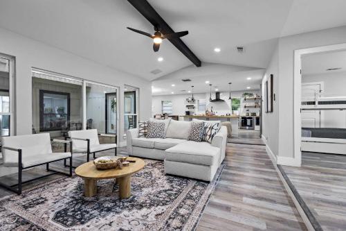 a living room with a couch and a table at Dallas Family Fun Haus with Pool and Massive Game Room in Dallas