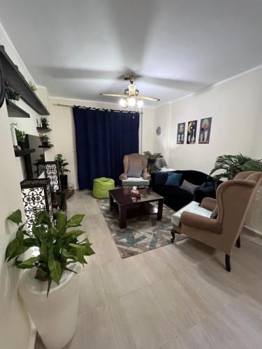 a living room with a couch and a table at AQUA View resort in El Alamein