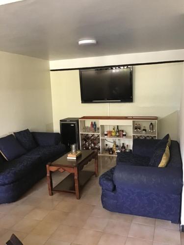 Телевизор и/или развлекательный центр в Apartamento Amoblado Refugio Urbano en Mérida